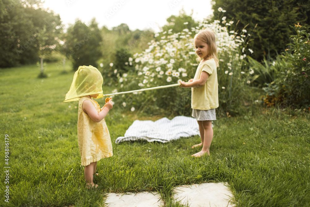Children play in nature with a net