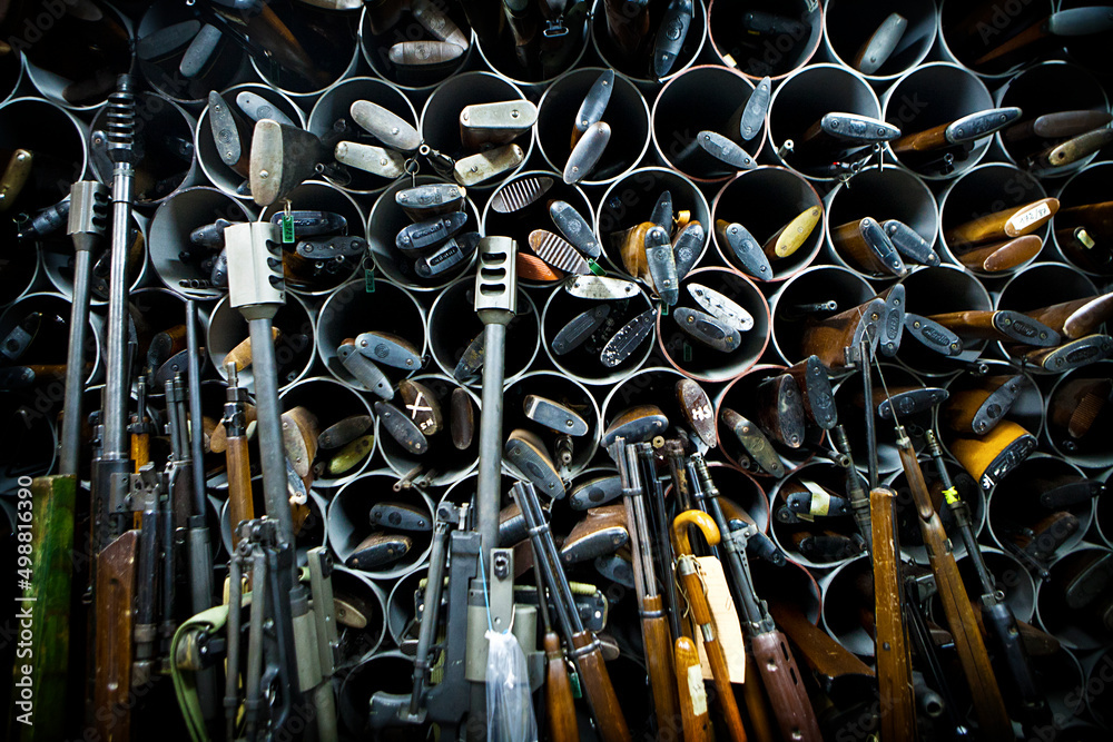 Criminal research ballistics department: stock of reference weapons. - obrazy, fototapety, plakaty 