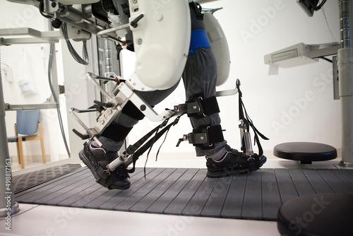 Obraz na plátne Gait training by robotic assistance to facilitate rehabilitation.