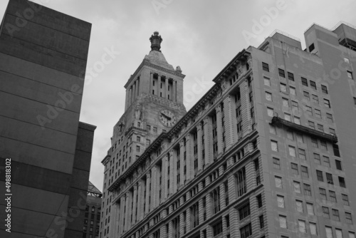 classic stone building with clock tower in East Village, New York City in black and white