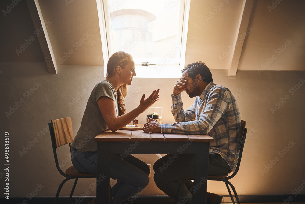 Perfect relationships do not exist but true love does. Shot of a couple having a disagreement at a cafe. Perfect relationships do not exist but true love does. Shot of a couple having a disagreement at a cafe.