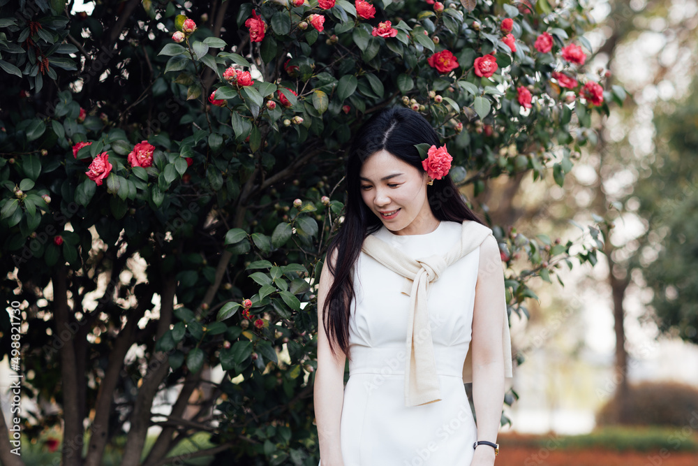 Candid lifestyle Portrait of happy young beautiful asian sexy woman enjoying life outdoor in park at spring. Smiling millennial girl with perfect clear glow skin and long brunette hair Candid lifestyle Portrait of happy young beautiful asian sexy woman enjoying life outdoor in park at spring. Smiling millennial girl with perfect clear glow skin and long brunette hair