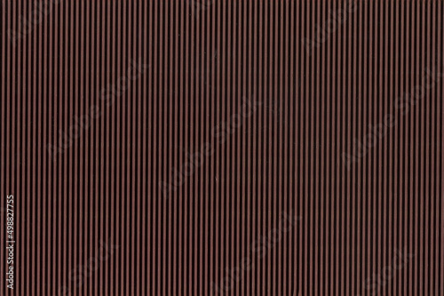 Colored Corrugated wall, brown background, vertical texture