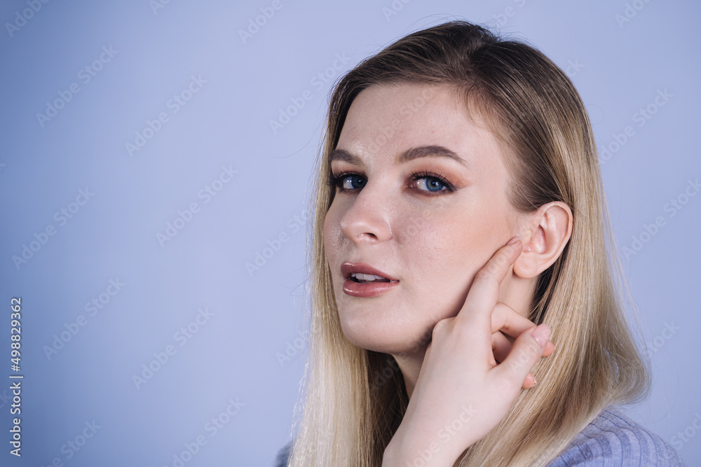 Beautiful young business woman portrait, Smiling cute female with long hair with copy space, Isolated on blue background Beautiful young business woman portrait, Smiling cute female with long hair with copy space, Isolated on blue background