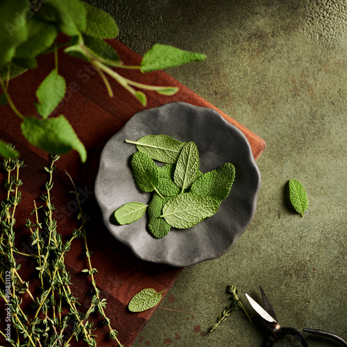 Sage and Thyme herbs on a plate photo