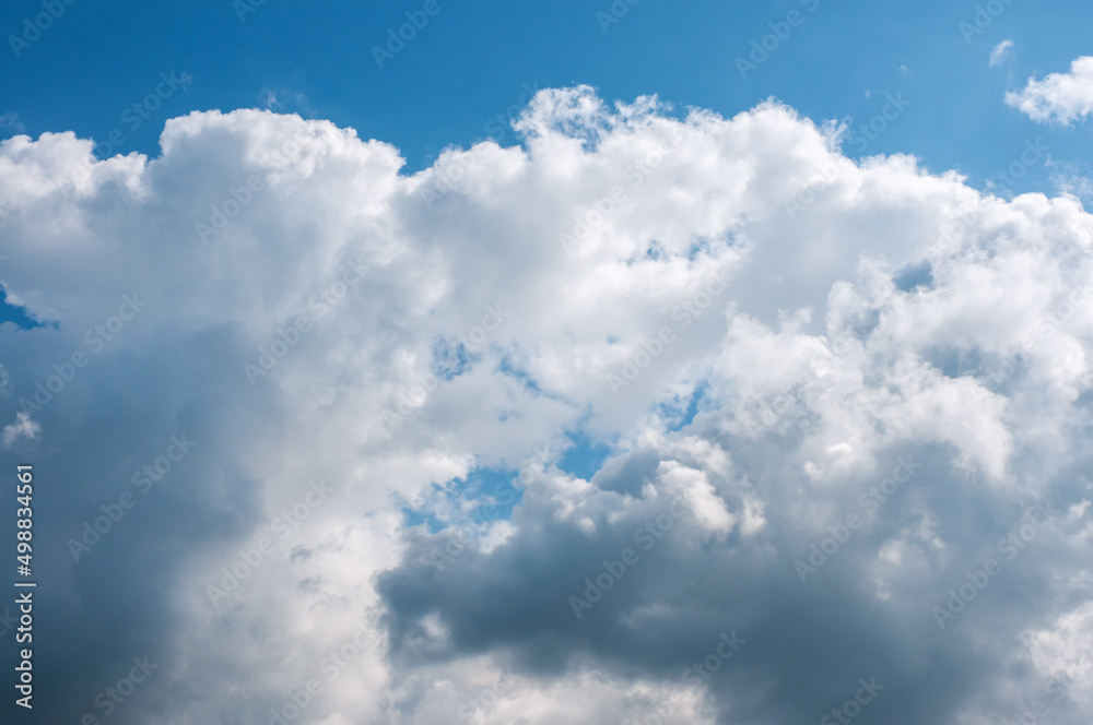 Cloud in blue sky on sunny summer day is natural background. Cloud is white. Cloud in blue sky on sunny summer day is natural background. Cloud is white.