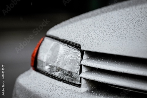 JDM classic car. Shot on a rainy day. Details of a sports car. Mechanical workshop.  photo