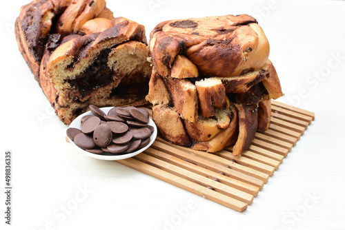 Εκτύπωση καμβά Large chocolate artisan bread, extra chocolate displayed on white wood