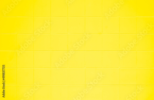 Yellow ceramic wall and floor tile abstract background. Design geometric gray mosaic texture decoration hospital wall, canteen and kitchen. 