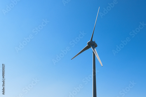 Energy and electricty production by wind turbine for renewable clean power and energy supply photo