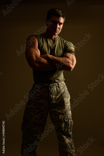 The handsome military man poses for the photo.