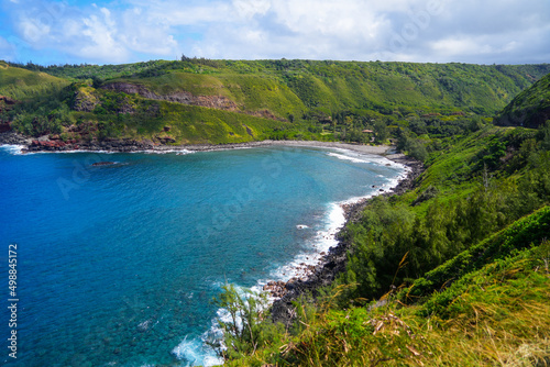 Honokohau Bay between the Kahekili and Honoapiilani highways on West Maui  Hawaii - Lush valley ending on a gravel beach in the Pacific Ocean
