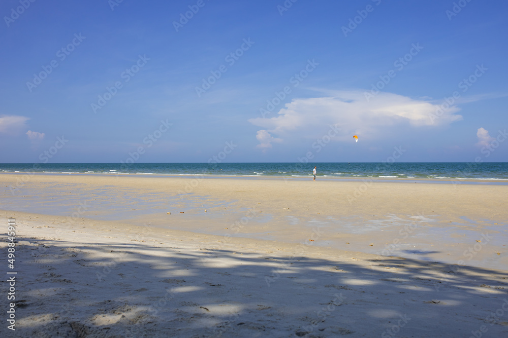 Obraz premium The Turquoise colored sand blue sky on sunny day and space on the sky
