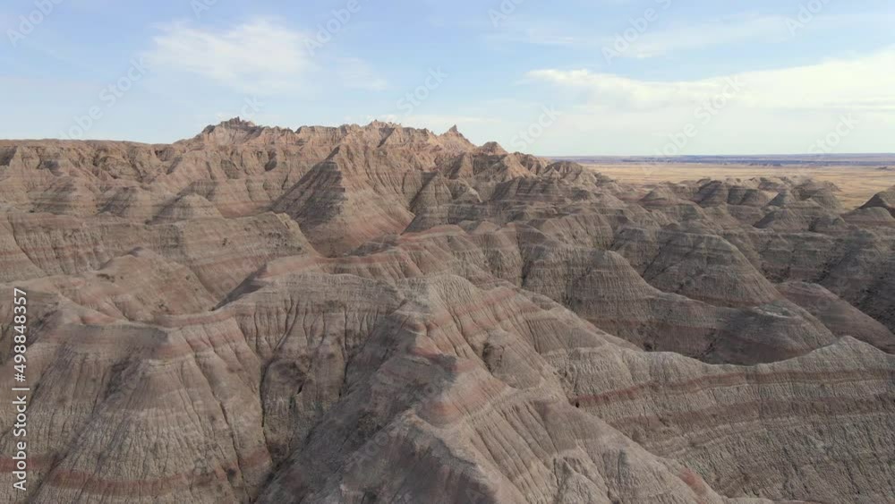Flying forward over desert hills mountains in Badlands National Park, South Dakota, natural landscape Flying forward over desert hills mountains in Badlands National Park, South Dakota, natural landscape