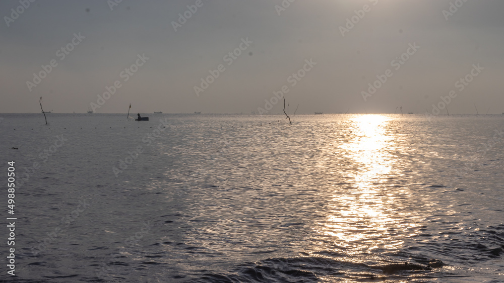 sunrise on the beach. beautiful summer scenery. calm waves on the water. clouds on the sky. wide panoramic view sunrise on the beach. beautiful summer scenery. calm waves on the water. clouds on the sky. wide panoramic view