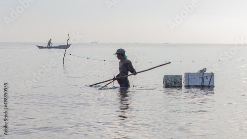 Shrimp fisherman carrying catch with Styrofoam