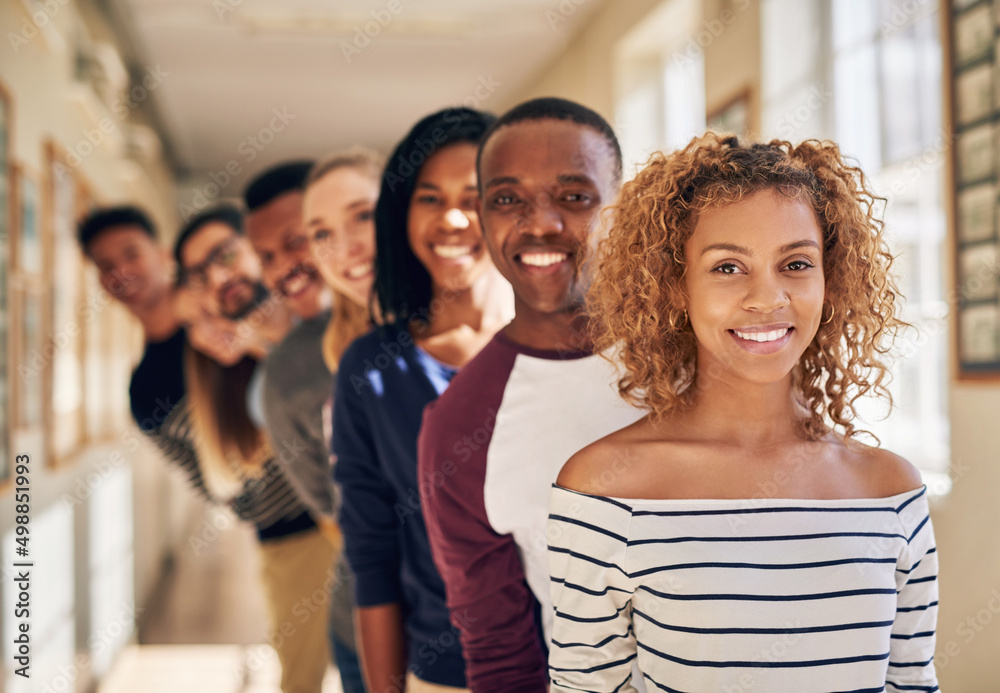 Obraz premium Greatness only begins here. Portrait of a diverse group of students standing in a line at campus.