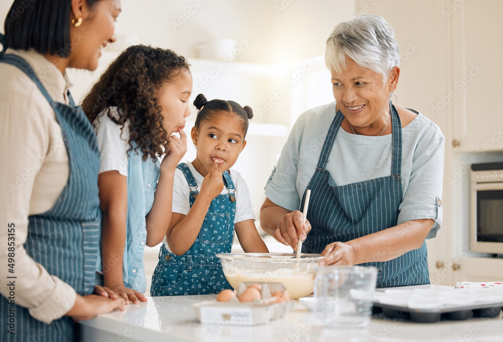 Your mom likes to like the bowl when she was your age. Shot of a multi-generational family baking together at home. Your mom likes to like the bowl when she was your age. Shot of a multi-generational family baking together at home.