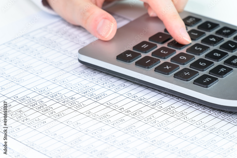 a person who is looking at financial statements in a company a person who is looking at financial statements in a company