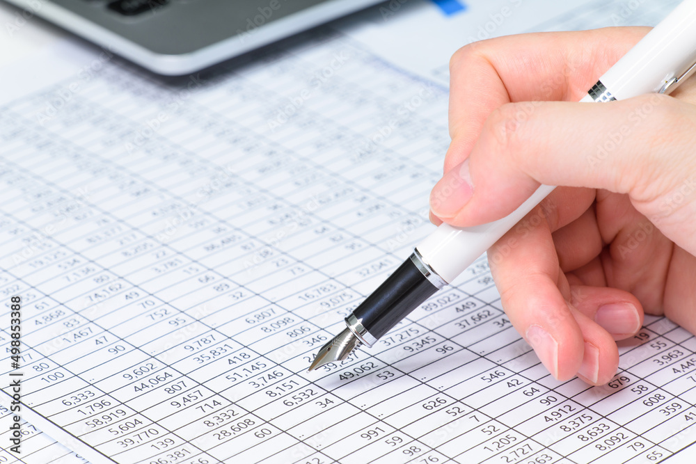 a person who is looking at financial statements in a company a person who is looking at financial statements in a company