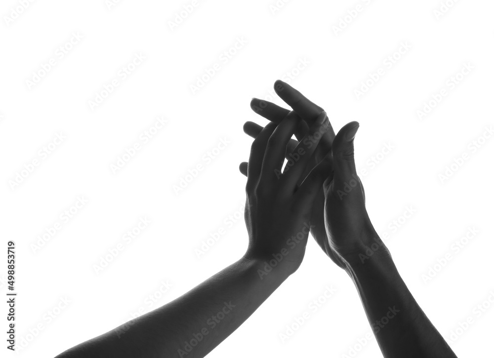 Silhouette of male and female hands on white background