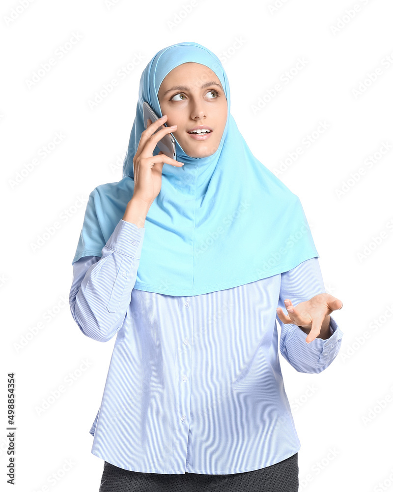 Muslim secretary talking by phone on white background Muslim secretary talking by phone on white background