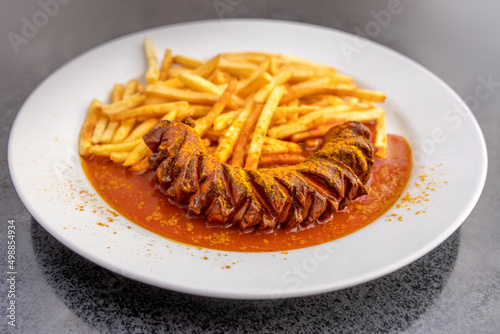 German Junk Food Dish Currywurst with French Fries