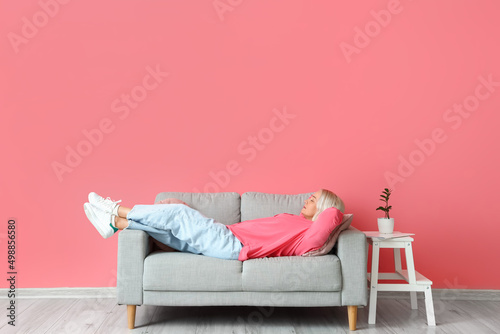 Mature woman relaxing on so...