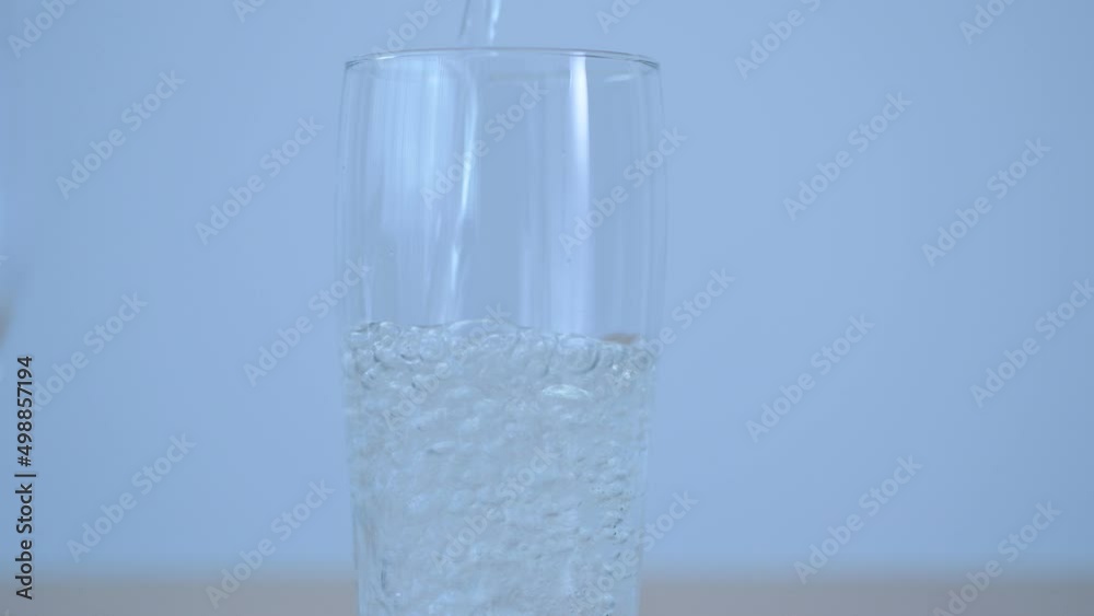 Pour carbonated water into clear glass Pour carbonated water into clear glass