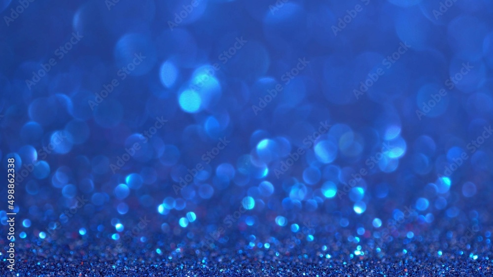 Shiny blue surface rotates. Magic bokeh background Shiny blue surface rotates. Magic bokeh background