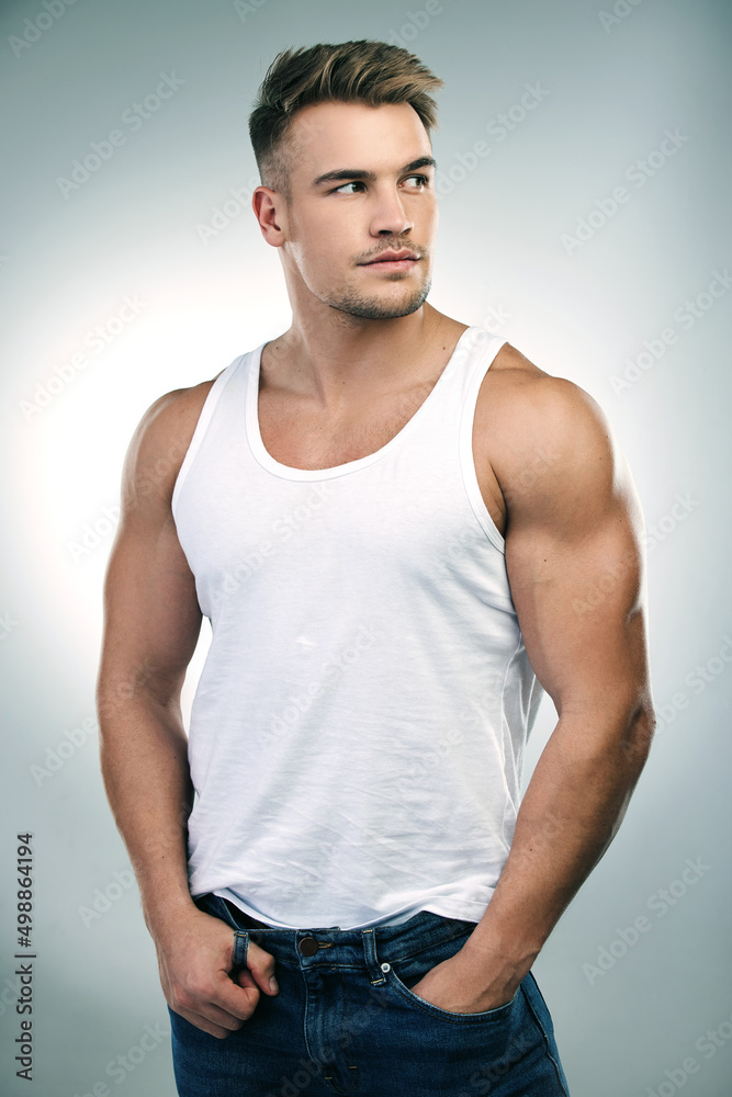 Wherever you go, never forget your goals. Studio shot of a handsome young man posing against a grey background. Wherever you go, never forget your goals. Studio shot of a handsome young man posing against a grey background.