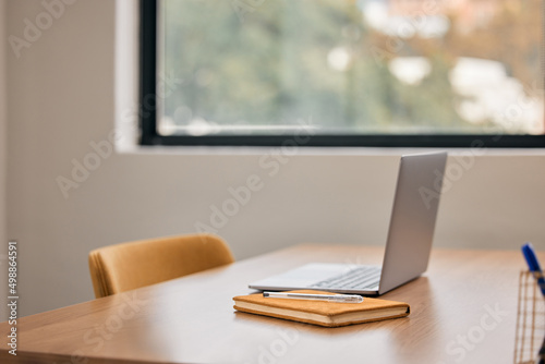 Sometimes freelancing is the way to go. Still life shot of a notebook and laptop on a desk in an office.