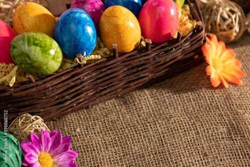 Collected Easter eggs into a brown wicker basket in time for Easter.