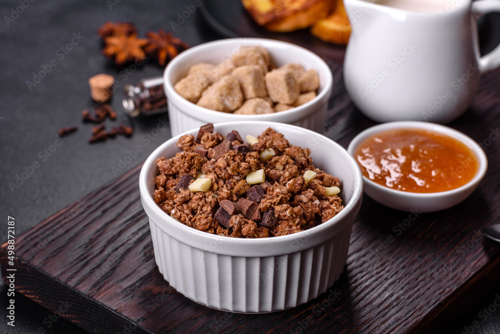 Cereal with chocolate, milk and bread in an egg against a dark concrete background Cereal with chocolate, milk and bread in an egg against a dark concrete background