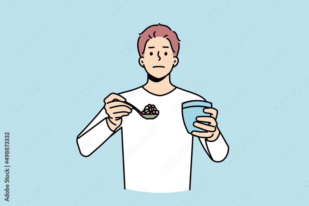 Portrait of young man have spoonful of pills with glass of water. Male patient hold spoon with medications suffer from drug or painkiller addiction. Healthcare and medicine. Vector illustration. 