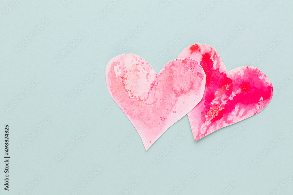 Cut the heart shaped paper, put on a pastel background.