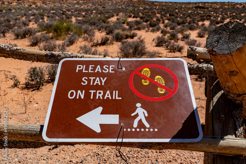 Please stay on the trail sign in a natural park