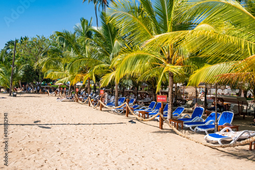 Sunbeds and umbrella on a tropical private beach