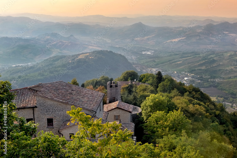 old house on a hill in and mountain landscape background in san marino- italy