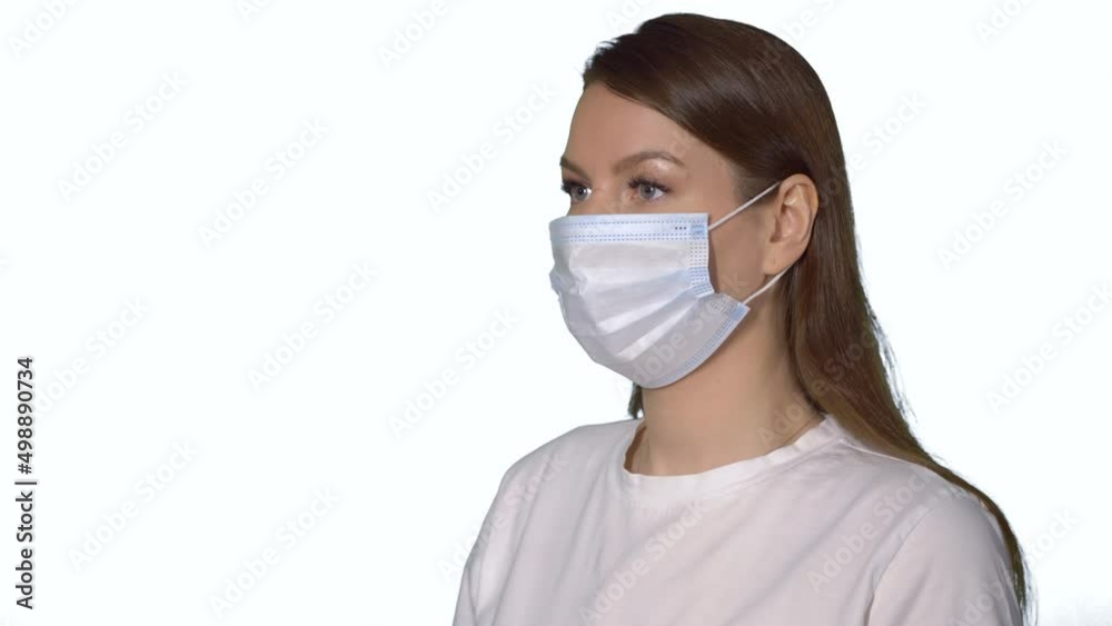 Young caucasian beautiful woman put on protective face mask. Young caucasian beautiful woman put on protective face mask.