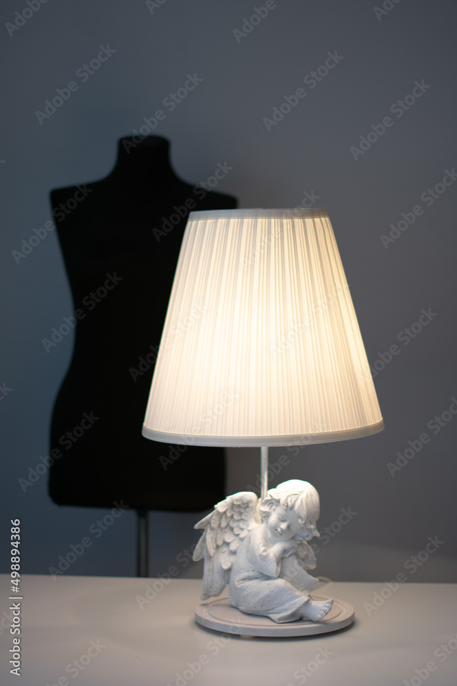 handmade floor lamp with an angel in the interior