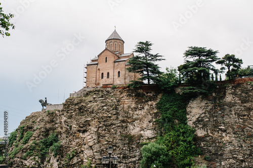 Ancient fortress Narikala Fortress with the St Nikolas church or Metekhi st Virgin Church in the old town of Tbilisi, Republic of Georgia, Caucasus. photo