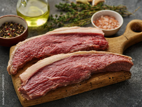Two Raw cap rump steak or top sirloin beef meat steak. Picanha steak with spices