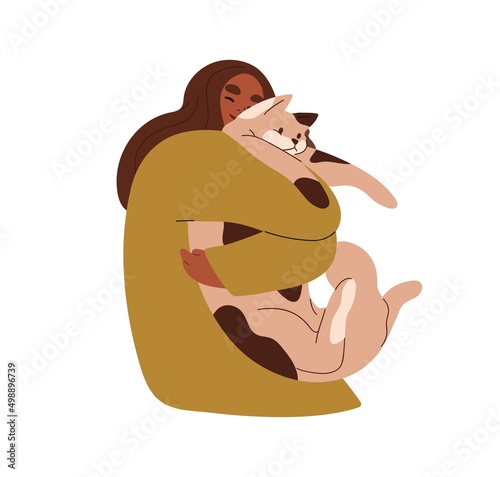 Happy woman holding big cute cat in hands. Pet owner hugging feline animal wi...