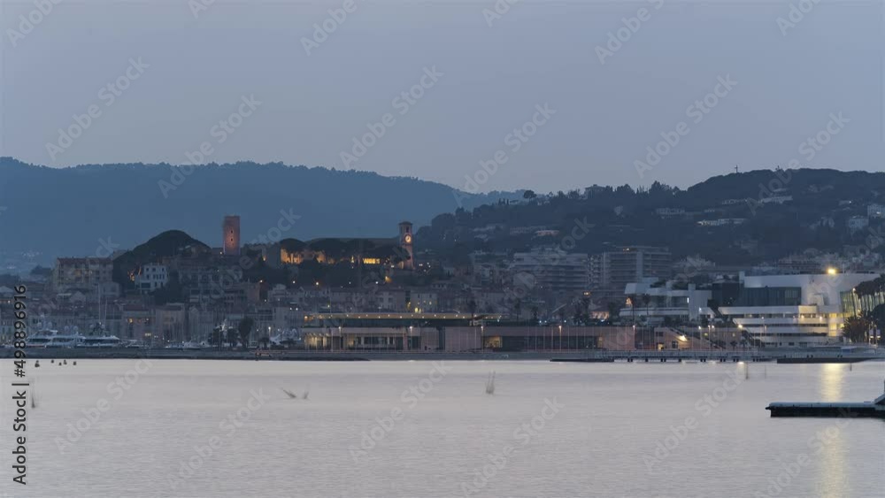 Cannes, France, Timelapse - The city of Cannes and its iconic Palais des Festivals et des Congrès from day to night as seen from the croisette Cannes, France, Timelapse - The city of Cannes and its iconic Palais des Festivals et des Congrès from day to night as seen from the croisette
