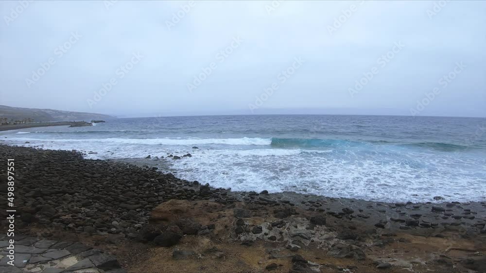 Panning to the Right with the Sea Waves arriving at the Black Sand. Panning to the Right with the Sea Waves arriving at the Black Sand.