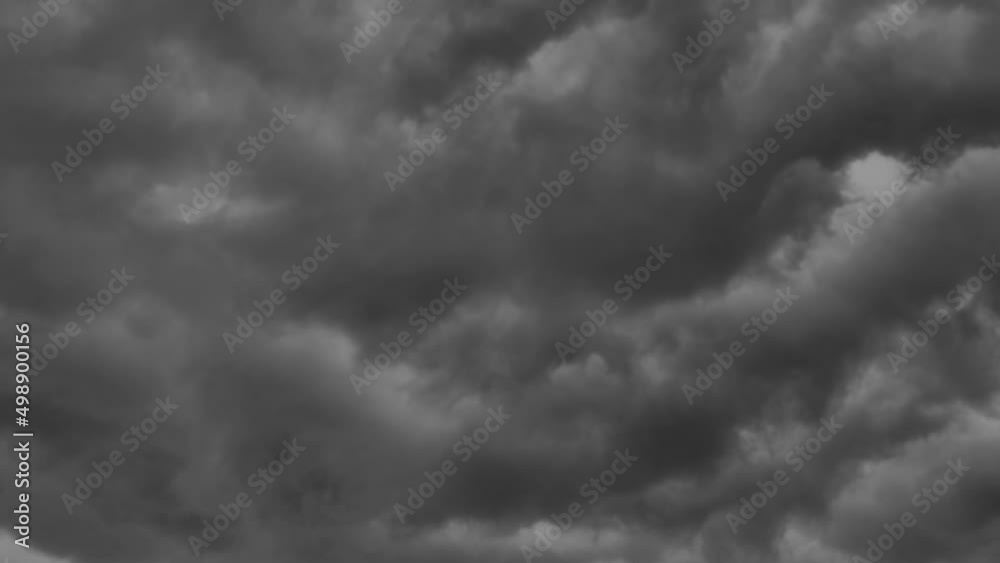 Dark clouds swirl and fly quickly across the sky. A hurricane is approaching. Cyclone with thunderstorm and rain. Weather change Dark clouds swirl and fly quickly across the sky. A hurricane is approaching. Cyclone with thunderstorm and rain. Weather change
