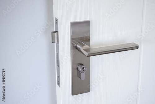 Modern door handle with on white door