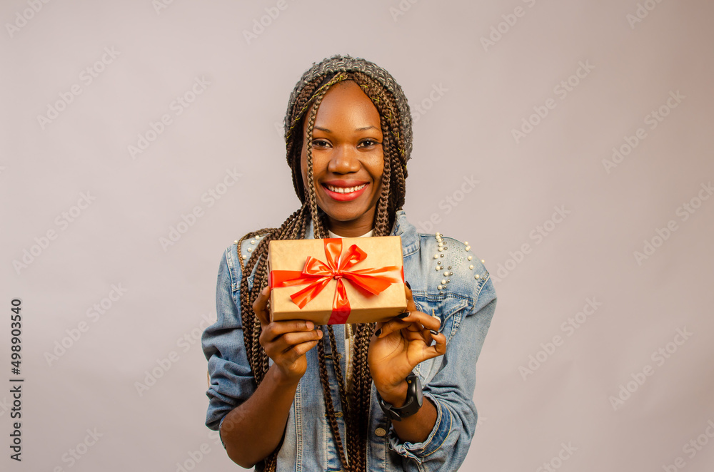 lady holding gift, package, box and present on her smiling