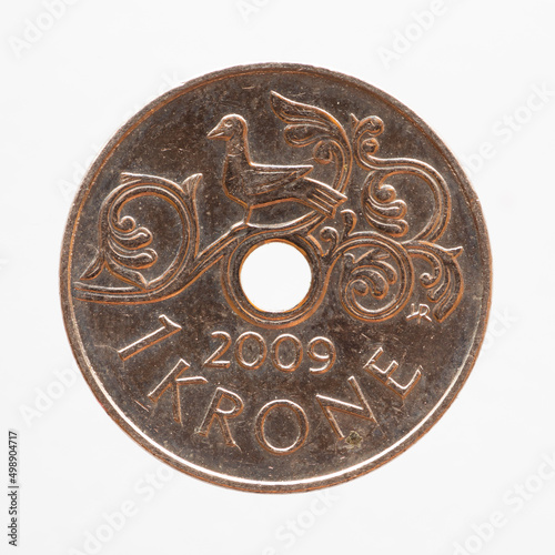 Norway - circa 2009: one krone coin of Norway showing a bird on an artistically designed branch